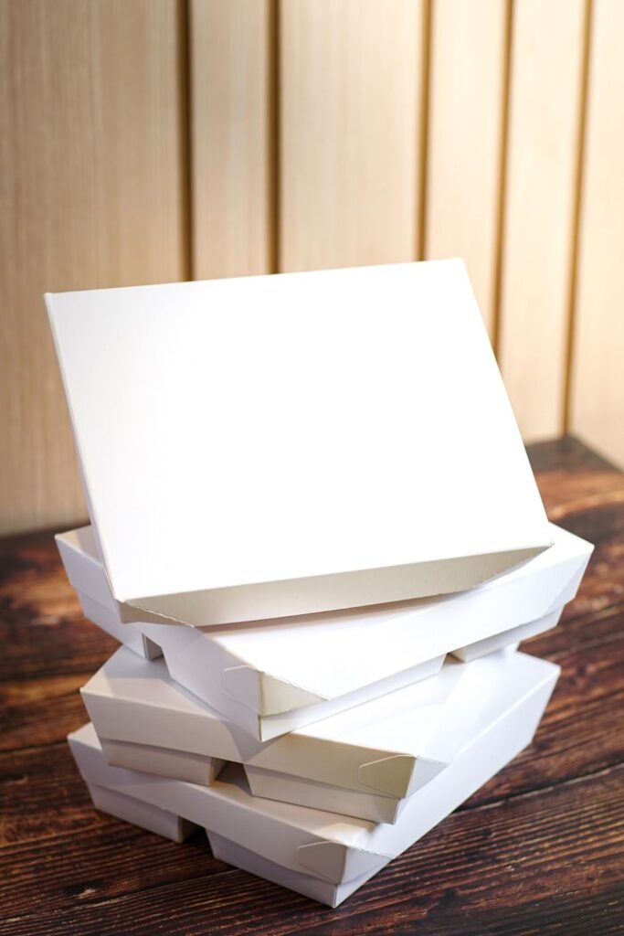 The Art of Drawing Readers In: Your attractive post title goes here Minimalist photo of stacked white boxes perfect for package design and branding.